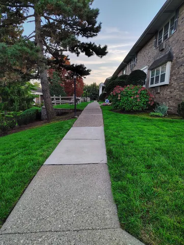 a view of a patio with a garden