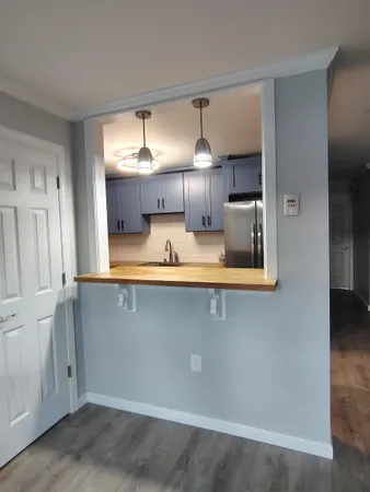 a kitchen with a sink cabinets and appliances