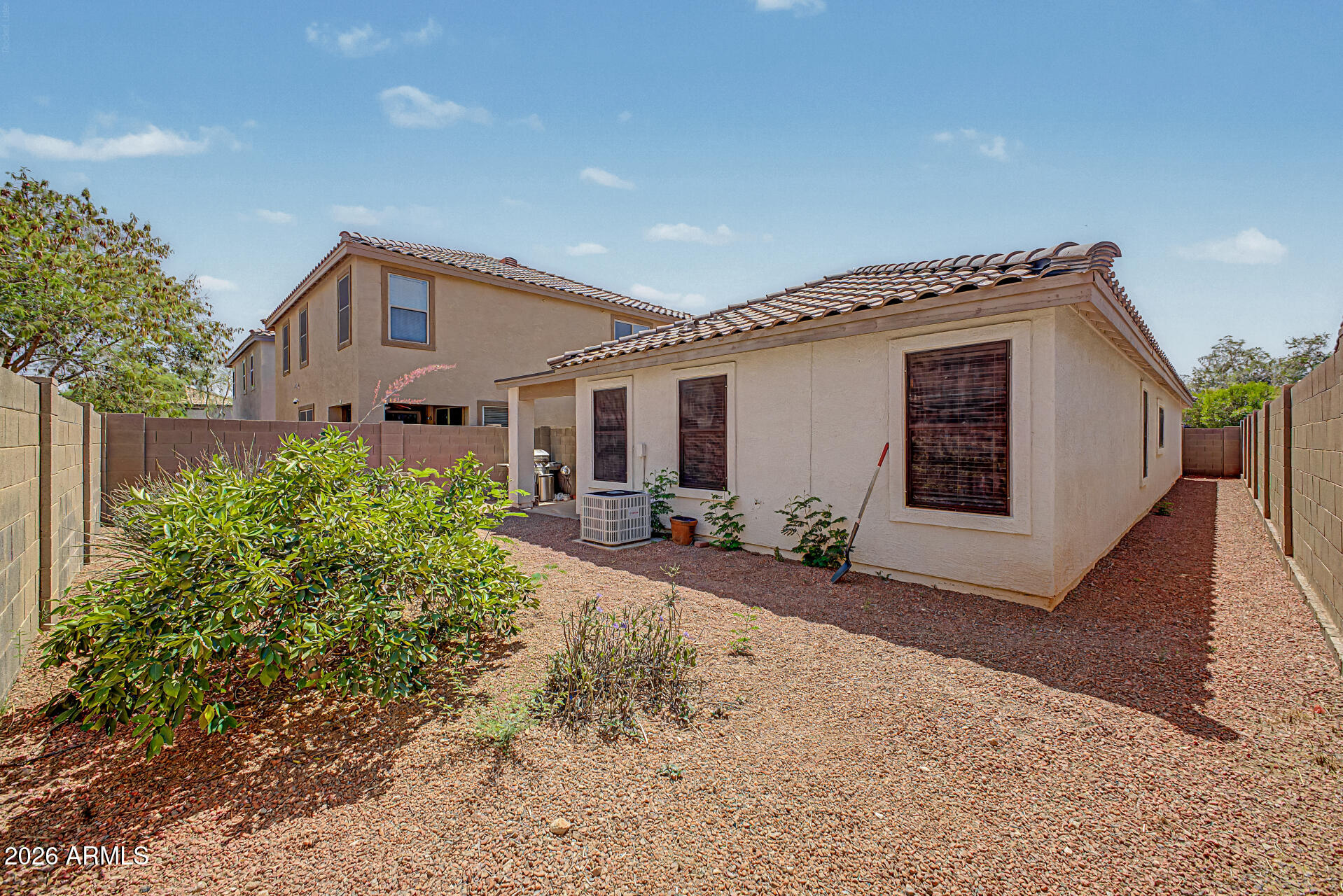 3489 South Bowman Road Apache Junction, AZ 85119 - Photo 24 of 24 a front view of a house with garden