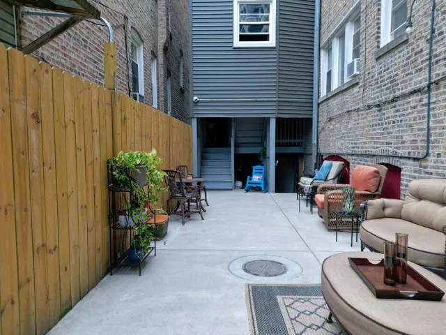 a backyard of a house with seating space