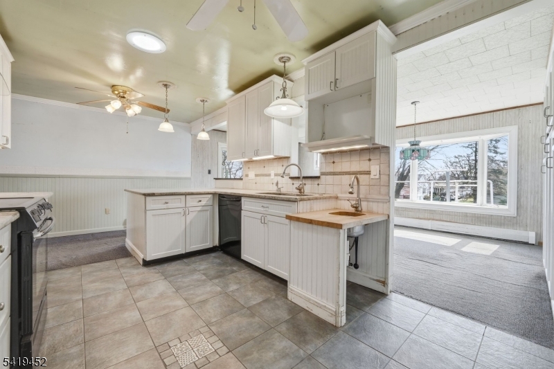 808 Charles Road Phillipsburg, NJ 08865 - Photo 12 of 33 a kitchen with a sink stove and cabinets