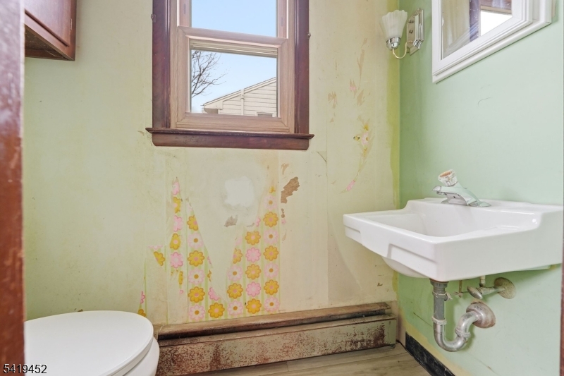 808 Charles Road Phillipsburg, NJ 08865 - Photo 18 of 33 a bathroom with a sink mirror vanity and toilet