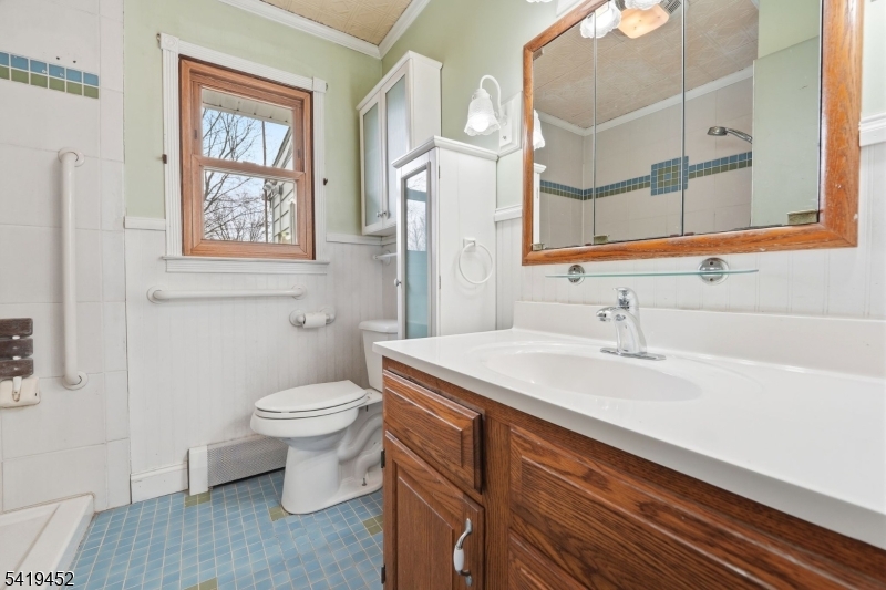 808 Charles Road Phillipsburg, NJ 08865 - Photo 22 of 33 a bathroom with a sink a toilet and a mirror