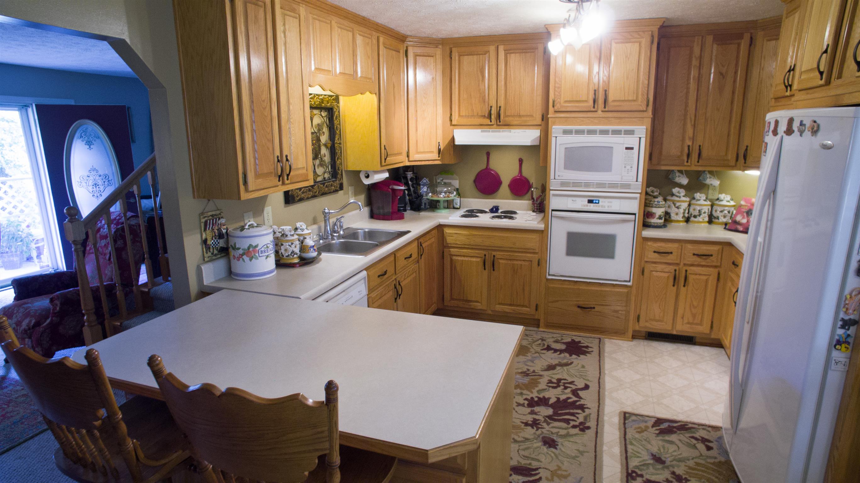 3800 Adamson Branch Road Liberty, TN 37095 - Photo 16 of 29 Tall Maple Cabinets with white appliances and pantry