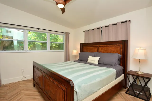 a bedroom with a bed and window