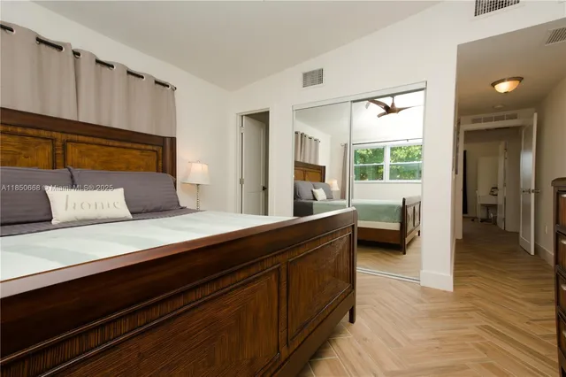 a living room with furniture and large windows