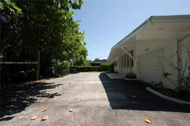 a terrace with a bench and trees