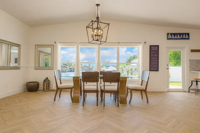 a view of a dining room with furniture window and outside view