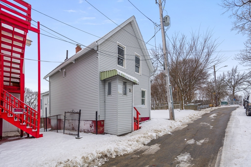 3 Ely Street Worcester, MA 01610 - Photo 15 of 17 a view of a house with a snow on the road