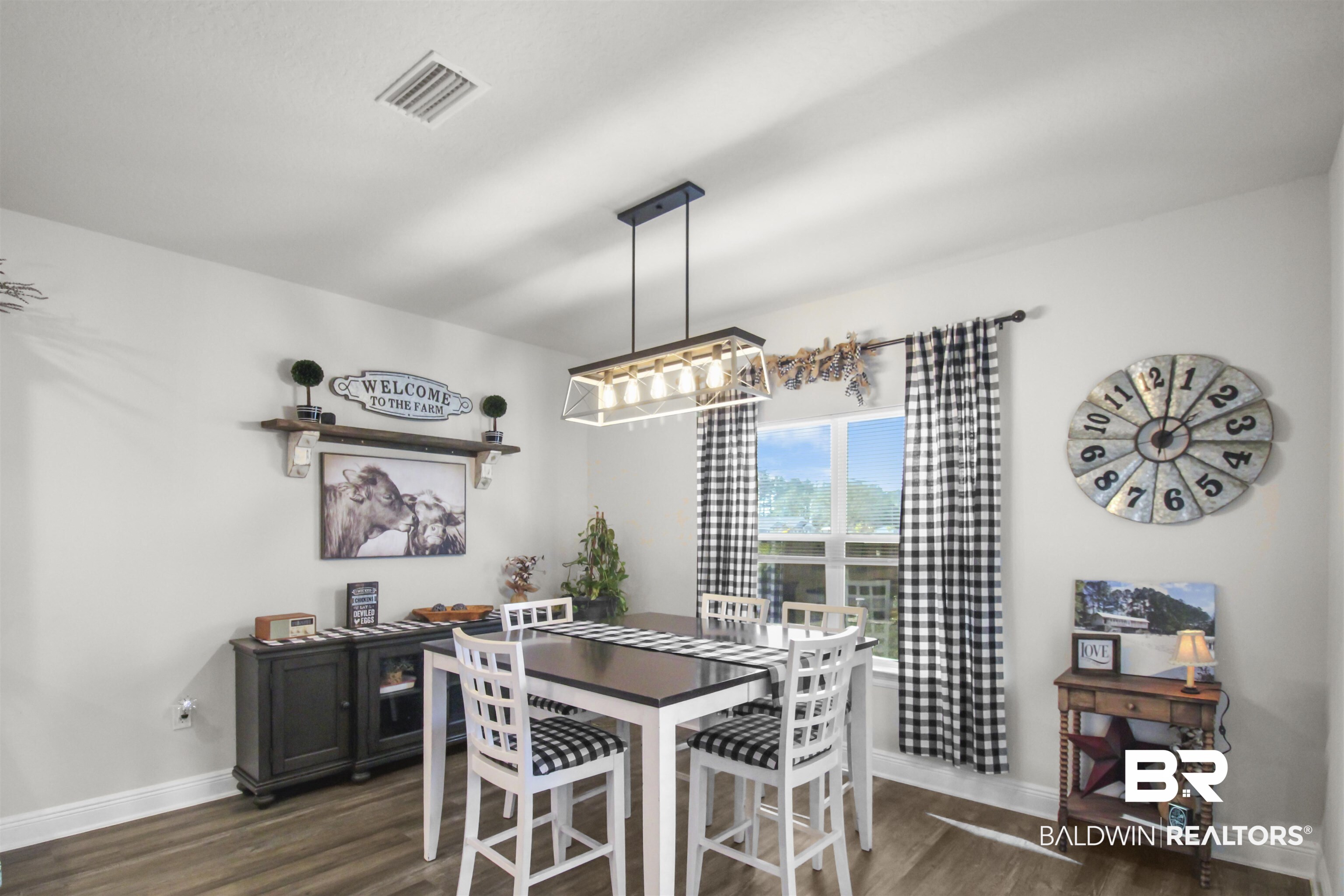 12523 Pheasant Run Elberta, AL 36530 - Photo 17 of 43 Dining area featuring dark wood-style flooring