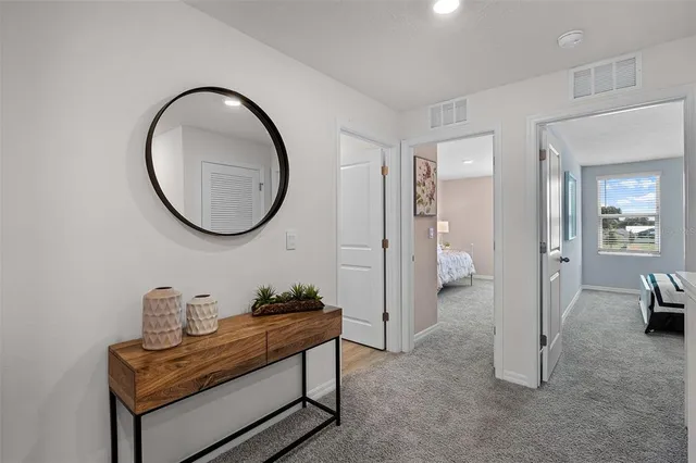 a room with furniture and a mirror