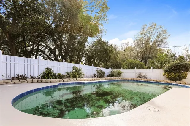 a view of swimming pool from a lake view