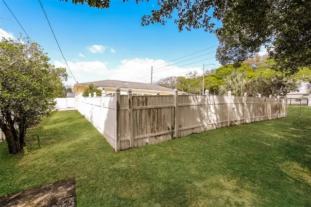 a view of a backyard with a garden and stairs