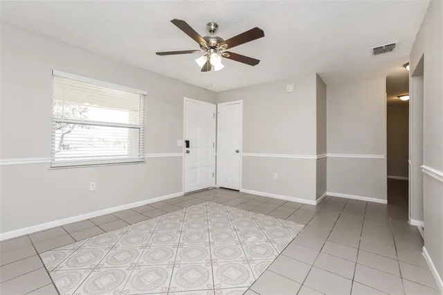 a view of an empty room with a window