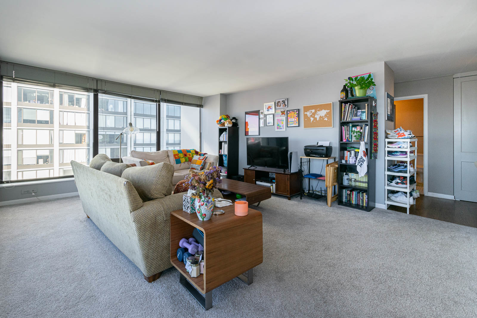 5445 North Sheridan Road, Unit 1701 Chicago, IL 60640 - Photo 4 of 11 a living room with furniture and a flat screen tv