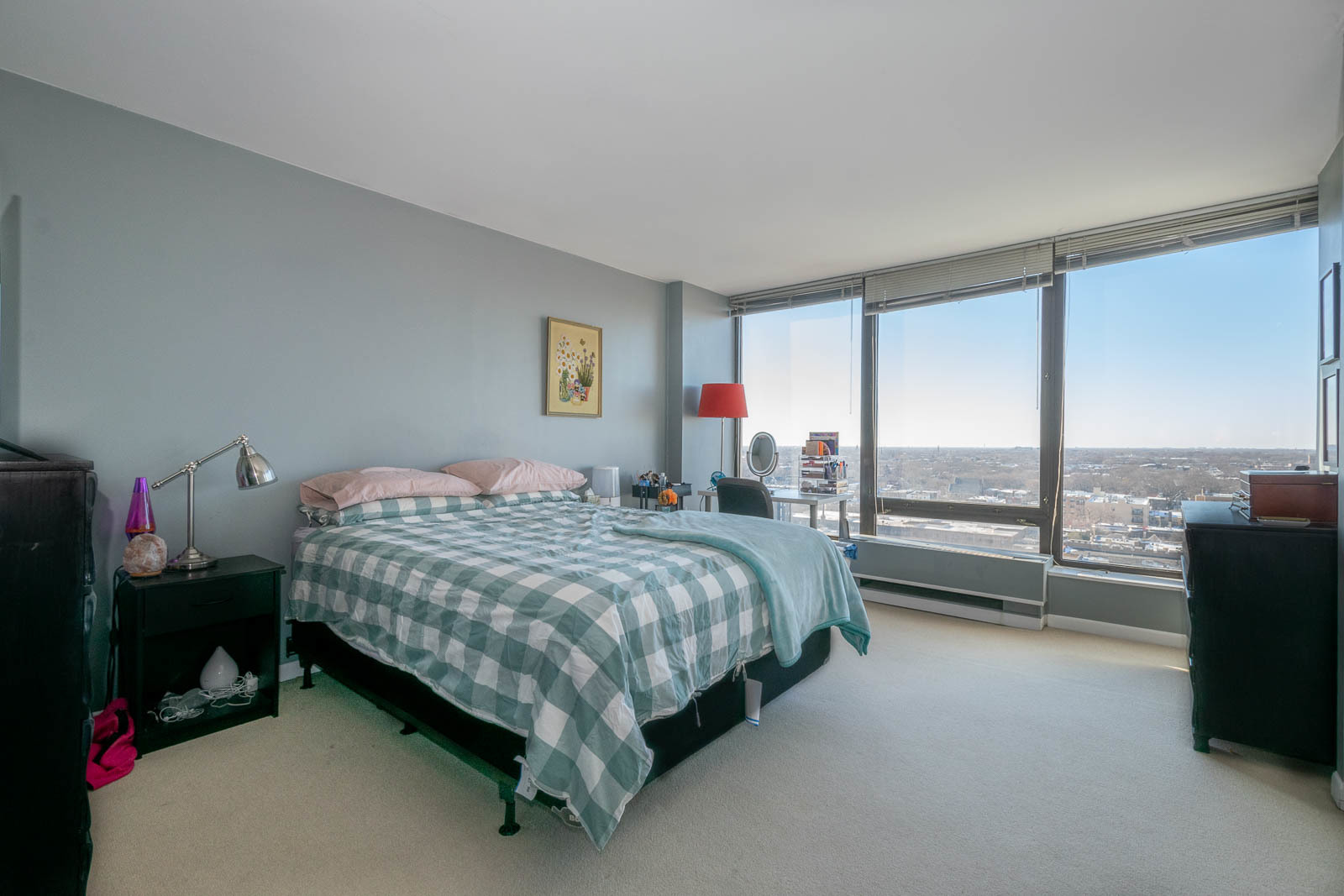 5445 North Sheridan Road, Unit 1701 Chicago, IL 60640 - Photo 7 of 11 a bedroom with a bed chair and window