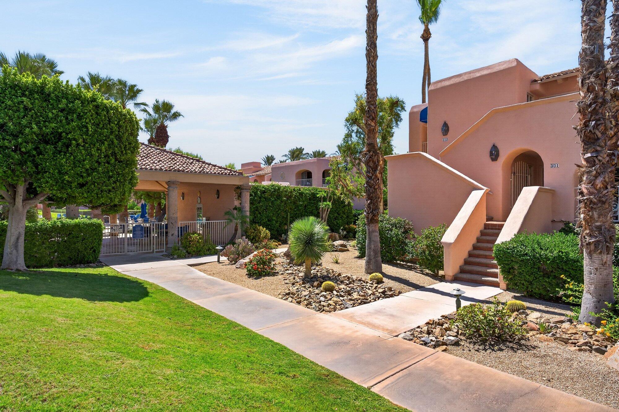 500 East Amado Road, Unit 313 Palm Springs, CA 92262 - Photo 23 of 32 a view of a backyard with a garden and plants