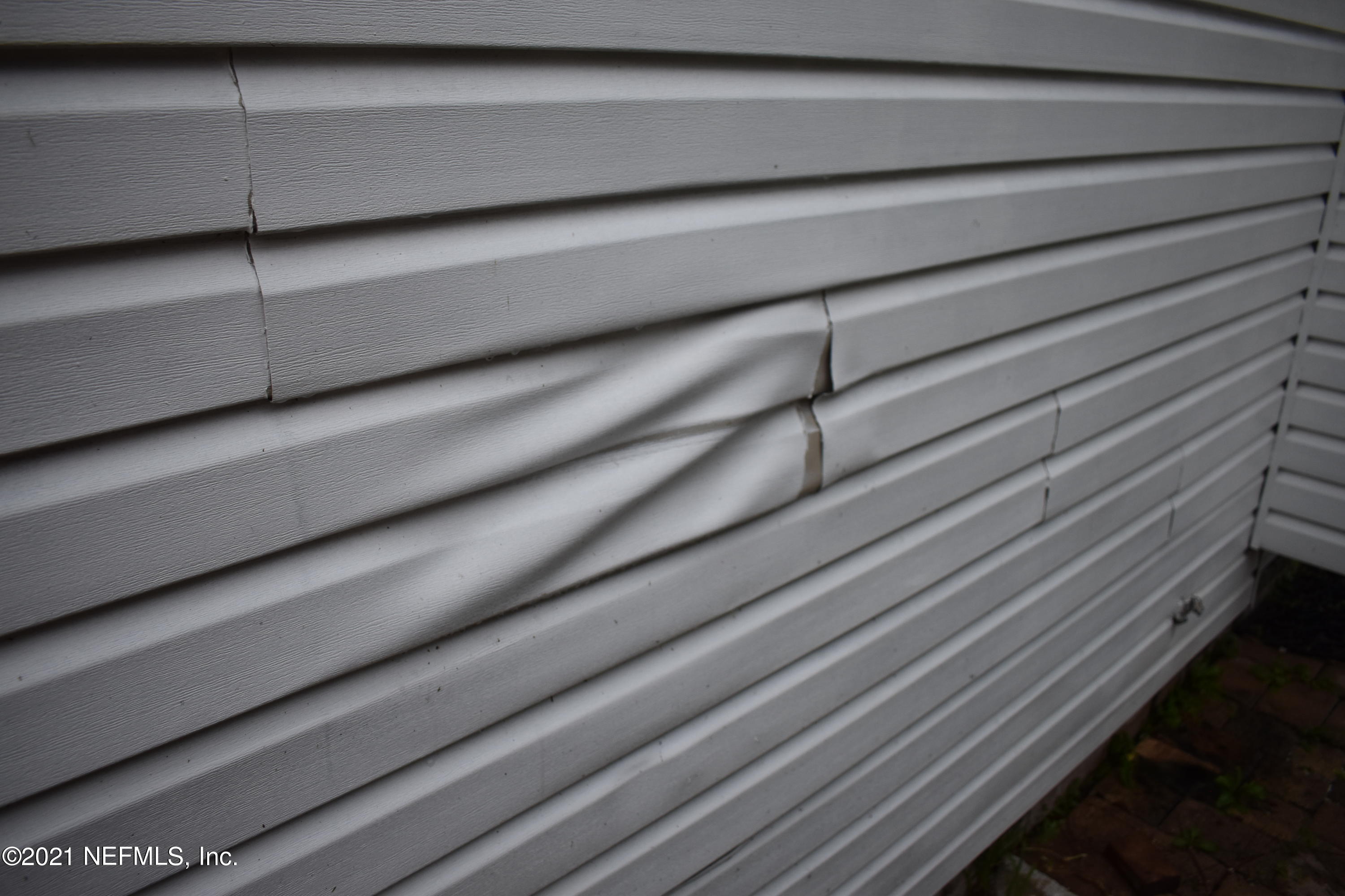 3678 North Ride Drive Jacksonville, FL 32223 - Photo 31 of 31 Hot Grill Damage to Vinyl Siding