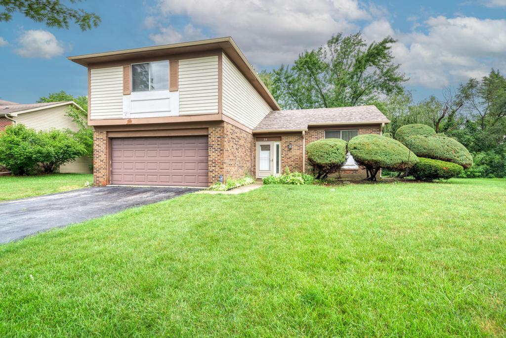 28 Willow Road Matteson, IL 60443 - Photo 1 of 30 a front view of a house with a yard