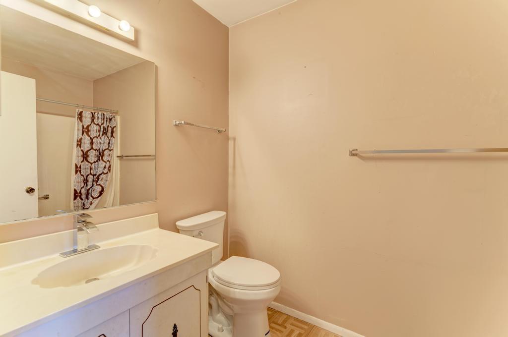 28 Willow Road Matteson, IL 60443 - Photo 20 of 30 a bathroom with a sink a toilet and a mirror