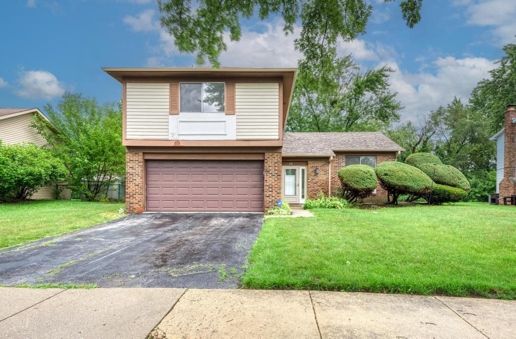 28 Willow Road Matteson, IL 60443 - Photo 2 of 30 a front view of a house with a yard and garage