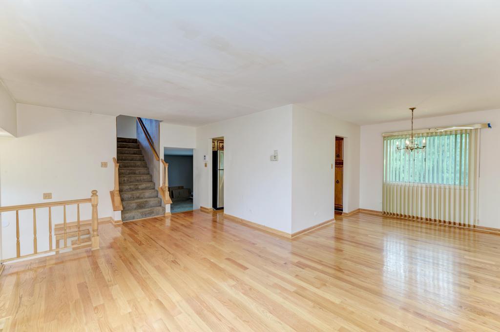 28 Willow Road Matteson, IL 60443 - Photo 6 of 30 a view of an empty room with wooden floor