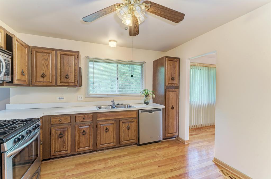 28 Willow Road Matteson, IL 60443 - Photo 9 of 30 a kitchen with a sink and wooden floor
