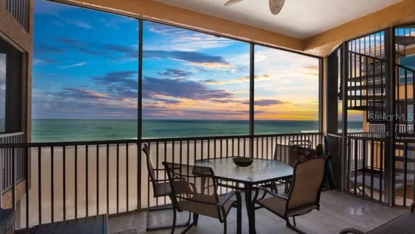 a view of a balcony with furniture