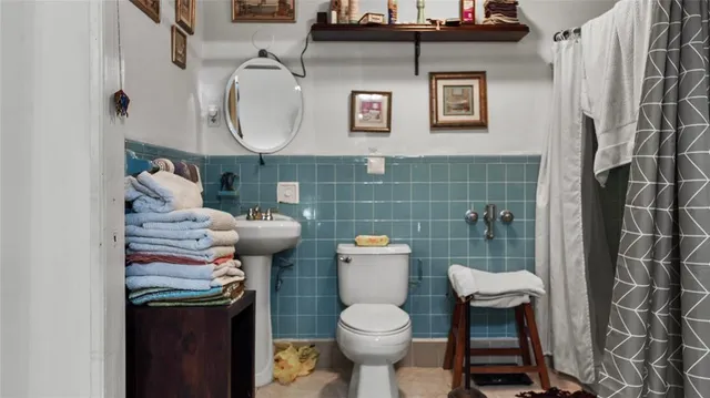 a bathroom with a toilet and a sink