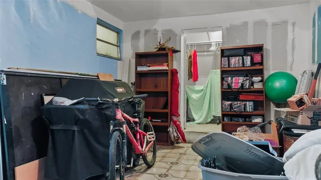 a view of a livingroom with furniture and closet