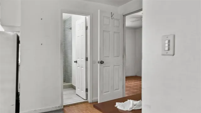 a view of a bathroom with a shower and a sink