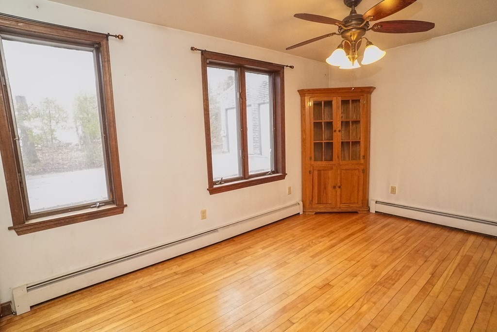 2 Perkins Lane Acushnet, MA 02743 - Photo 11 of 41 an empty room with windows and fan