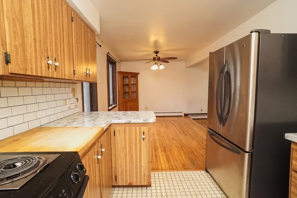 2 Perkins Lane Acushnet, MA 02743 - Photo 12 of 41 a kitchen with a refrigerator and a sink