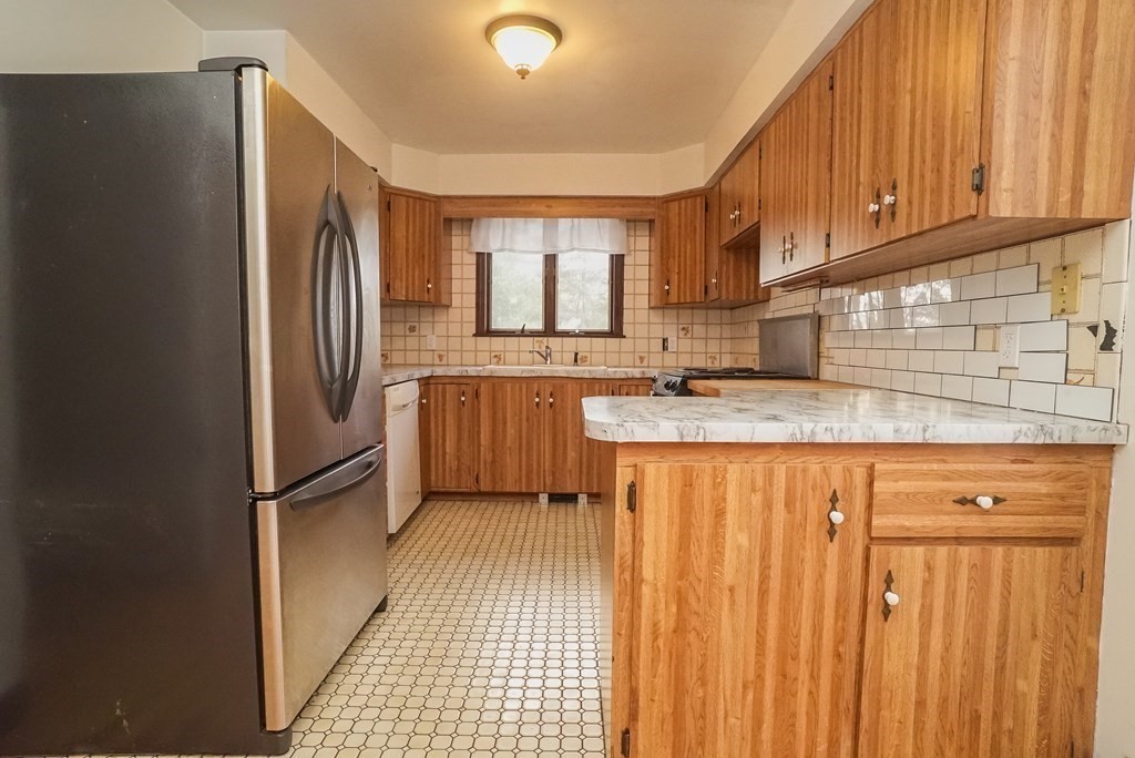 2 Perkins Lane Acushnet, MA 02743 - Photo 13 of 41 a kitchen with stainless steel appliances granite countertop a refrigerator and a sink