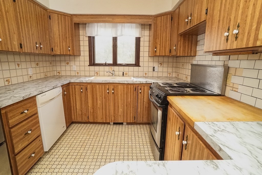 2 Perkins Lane Acushnet, MA 02743 - Photo 15 of 41 a kitchen with a sink stove and cabinets