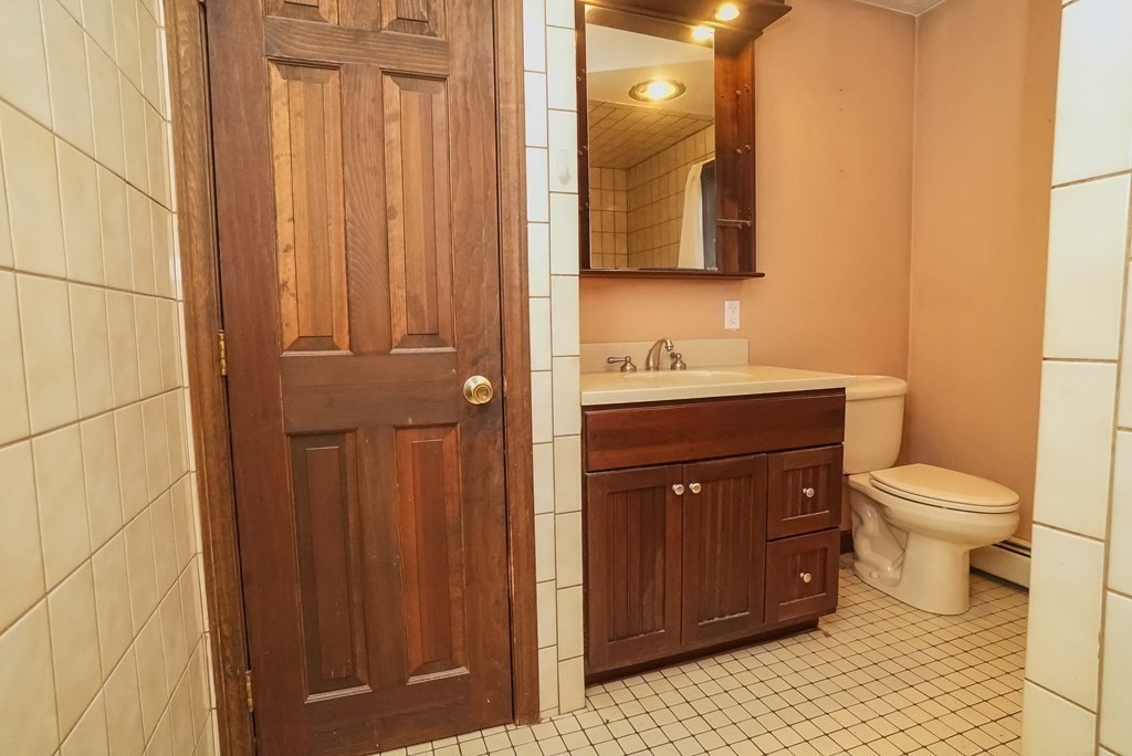 2 Perkins Lane Acushnet, MA 02743 - Photo 19 of 41 a bathroom with a sink a toilet and mirror