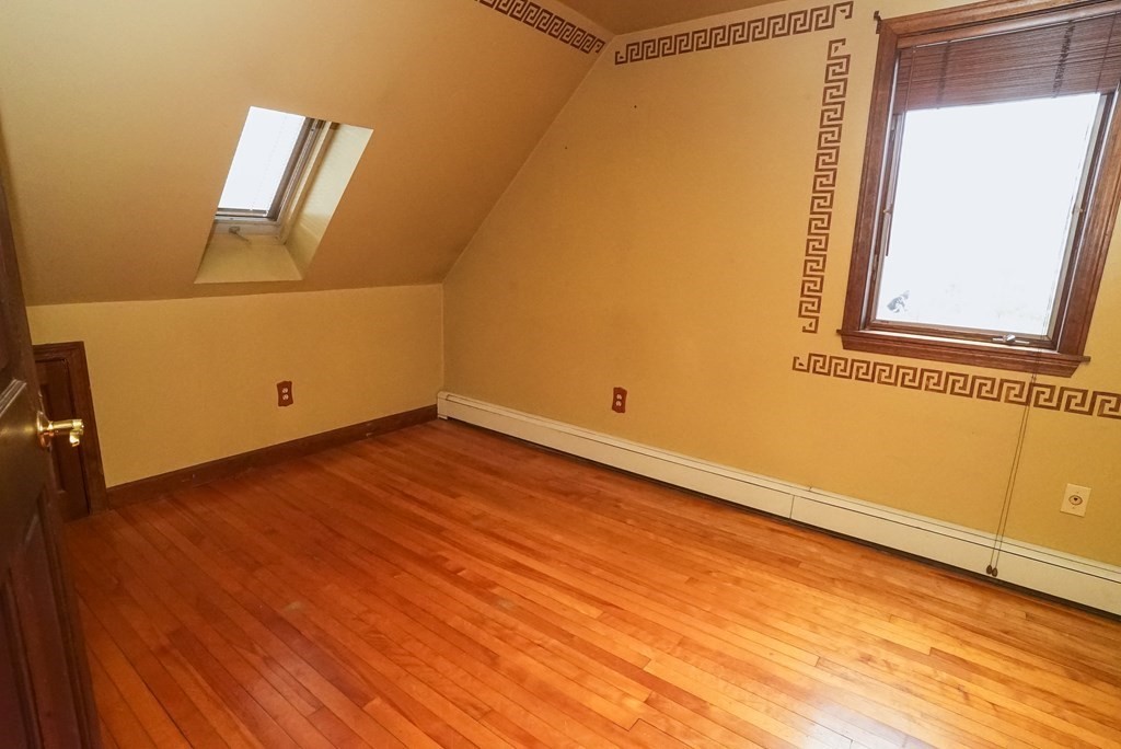 2 Perkins Lane Acushnet, MA 02743 - Photo 22 of 41 an empty room with wooden floor and windows