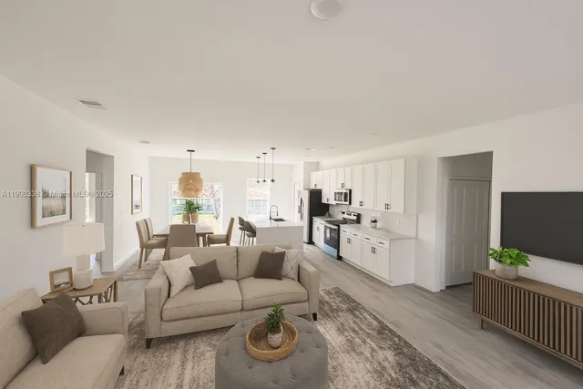 a living room with furniture and a flat screen tv