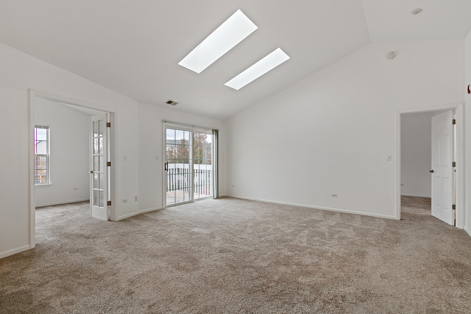 2604 Sheehan Court, Unit 204 Naperville, IL 60564 - Photo 2 of 19 an empty room with windows and ceiling fan