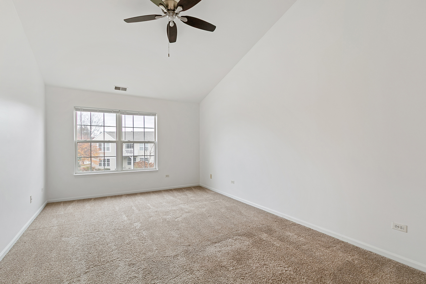 2604 Sheehan Court, Unit 204 Naperville, IL 60564 - Photo 10 of 19 a view of an empty room with a window
