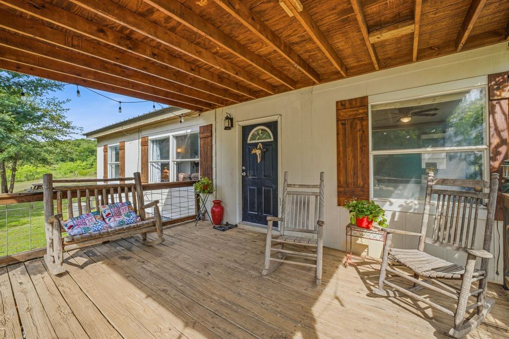 151 High Point Road Weatherford, TX 76088 - Photo 5 of 40 a view of a chairs with wooden floor