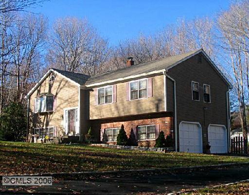 9 Rock Spring Road Trumbull, CT 06611 - Photo 1 of 1 a front view of a house with a yard