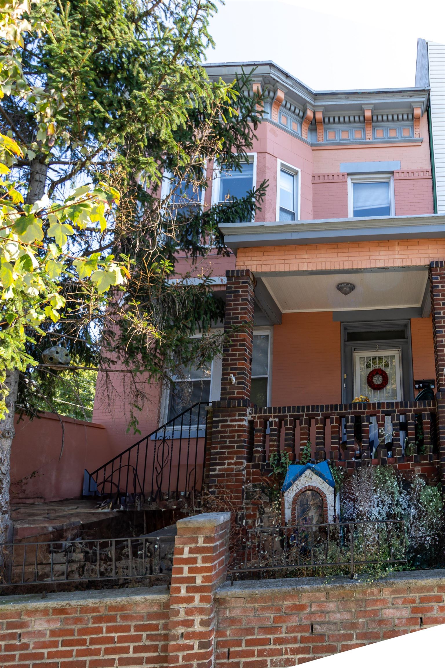 a front view of a house with basket ball court