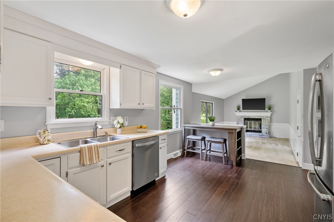 8841 Wandering Way Lysander, NY 13027 - Photo 38 of 42 Open floor plan featuring an eat-in kitchen overlooking the family room.