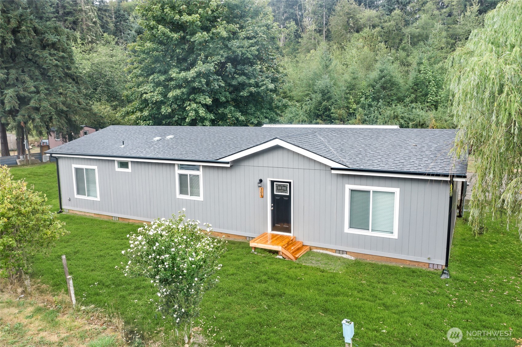 309 Sumner Street Bucoda, WA 98530 - Photo 2 of 35 a aerial view of a house next to a yard