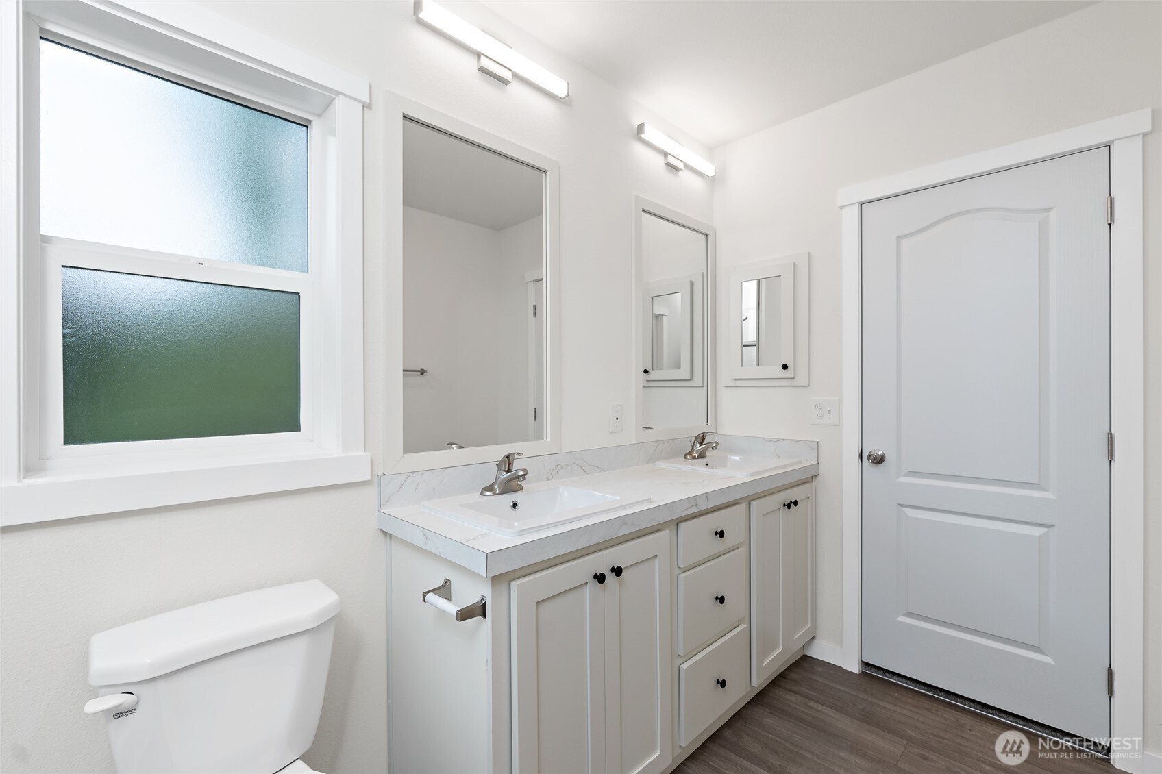309 Sumner Street Bucoda, WA 98530 - Photo 22 of 35 a spacious bathroom with a toilet a sink and mirror