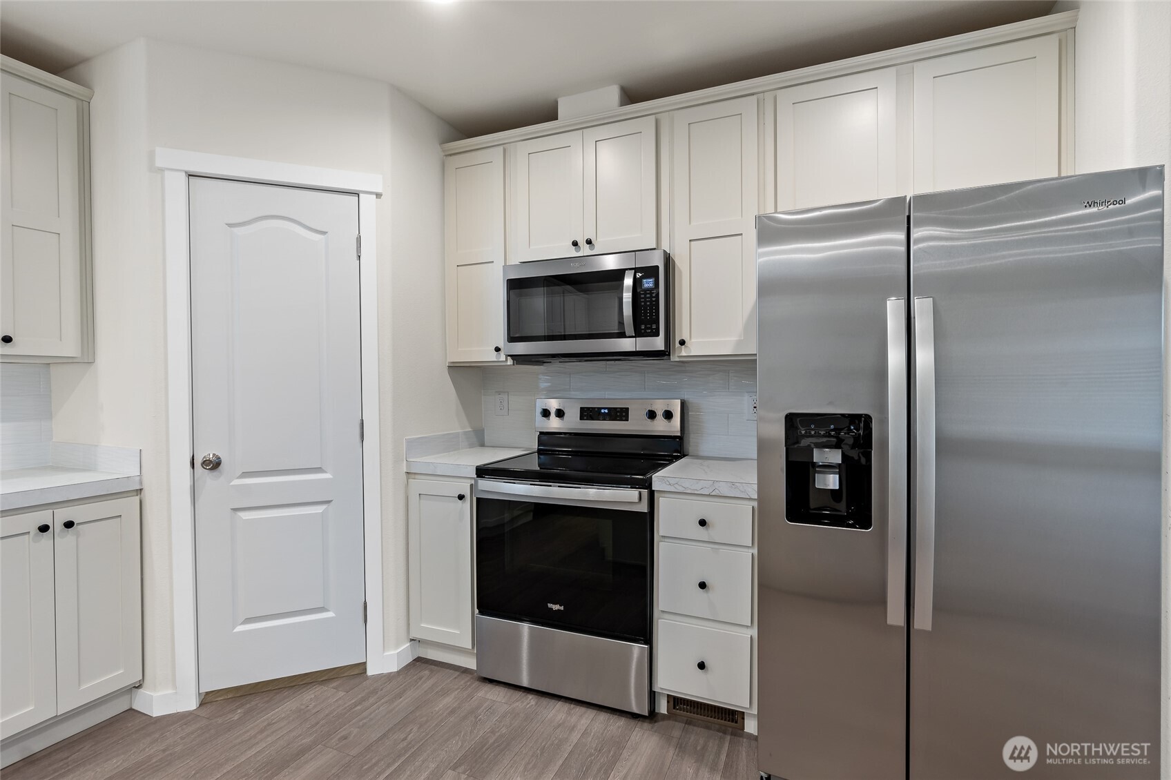 309 Sumner Street Bucoda, WA 98530 - Photo 10 of 35 a kitchen with stainless steel appliances white cabinets and a refrigerator