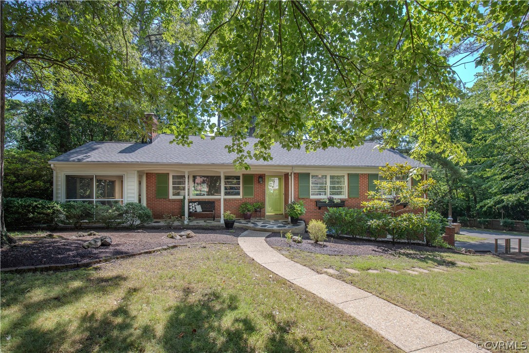 7706 Comanche Drive Richmond, VA 23225 - Photo 1 of 42 a front view of a house with garden