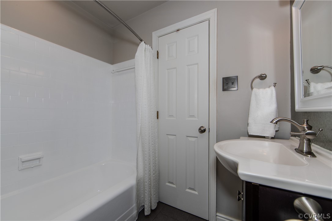 7706 Comanche Drive Richmond, VA 23225 - Photo 20 of 42 a bathroom with a sink and a mirror