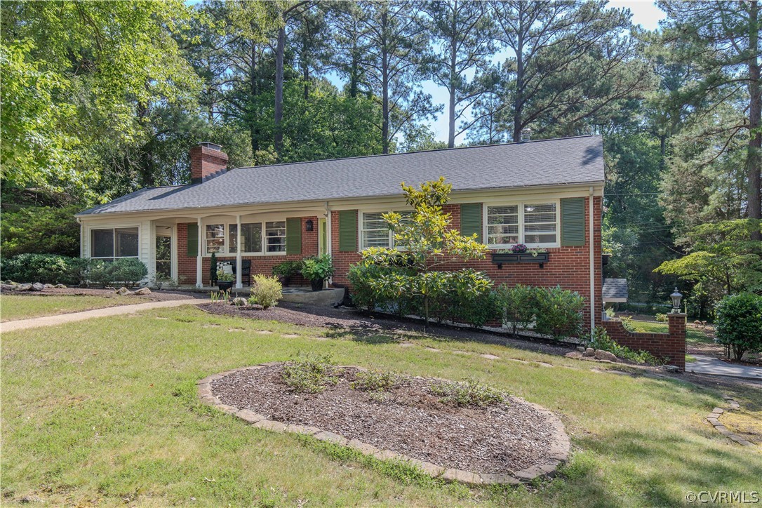 7706 Comanche Drive Richmond, VA 23225 - Photo 2 of 42 a view of a house with a swimming pool and a yard